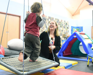 Dr. Jodi Morris enjoys some fun time with a youngster at the OSNS Child and Youth Development Centre this week where she was doing clinical evaluations for children and conducting the first in a series of workshops for parents.
Mark Brett/Western News